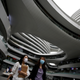 People wearing face masks walk at the Galaxy SOHO office and commercial buildings, following the novel coronavirus disease (COVID-19) outbreak, in Beijing